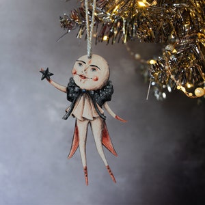 Double sided moon man wooden hanging ornament. Clement the moon. Vintage style illustration. Christmas tree ornament